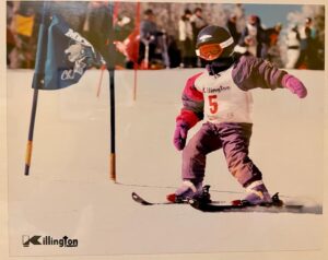 skier skis around a gate on a race hill