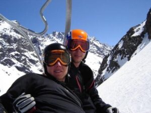 two skiers on a chairlift