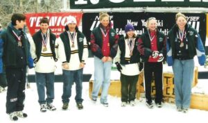 skiers pose together