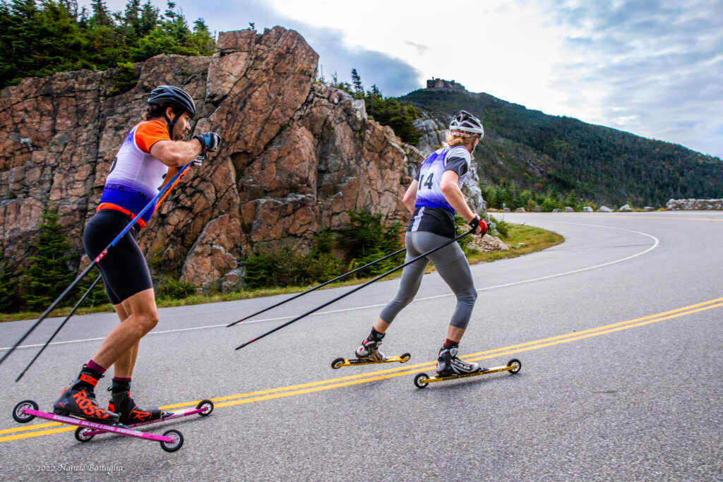 rollerskiers skiing up whiteface mountain