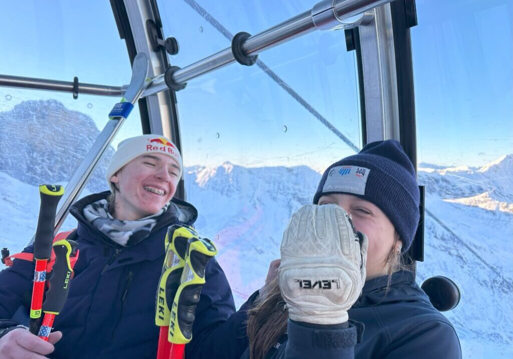 two nysefl athletes in a gondola in austria